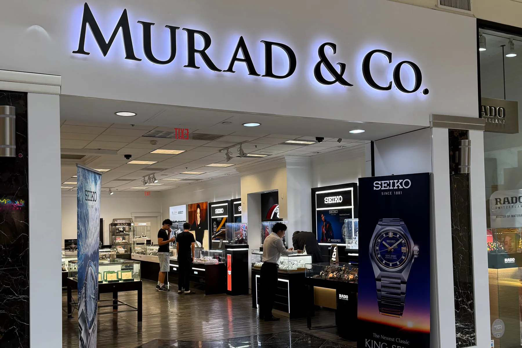 The Murad & Co storefront in Tysons with the event crowd visible inside