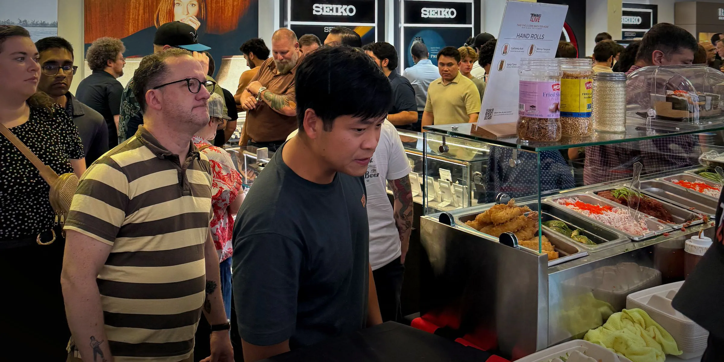Guests waiting their turn at the Temaki Live counter at Seiko and Sushi, Murad & Co